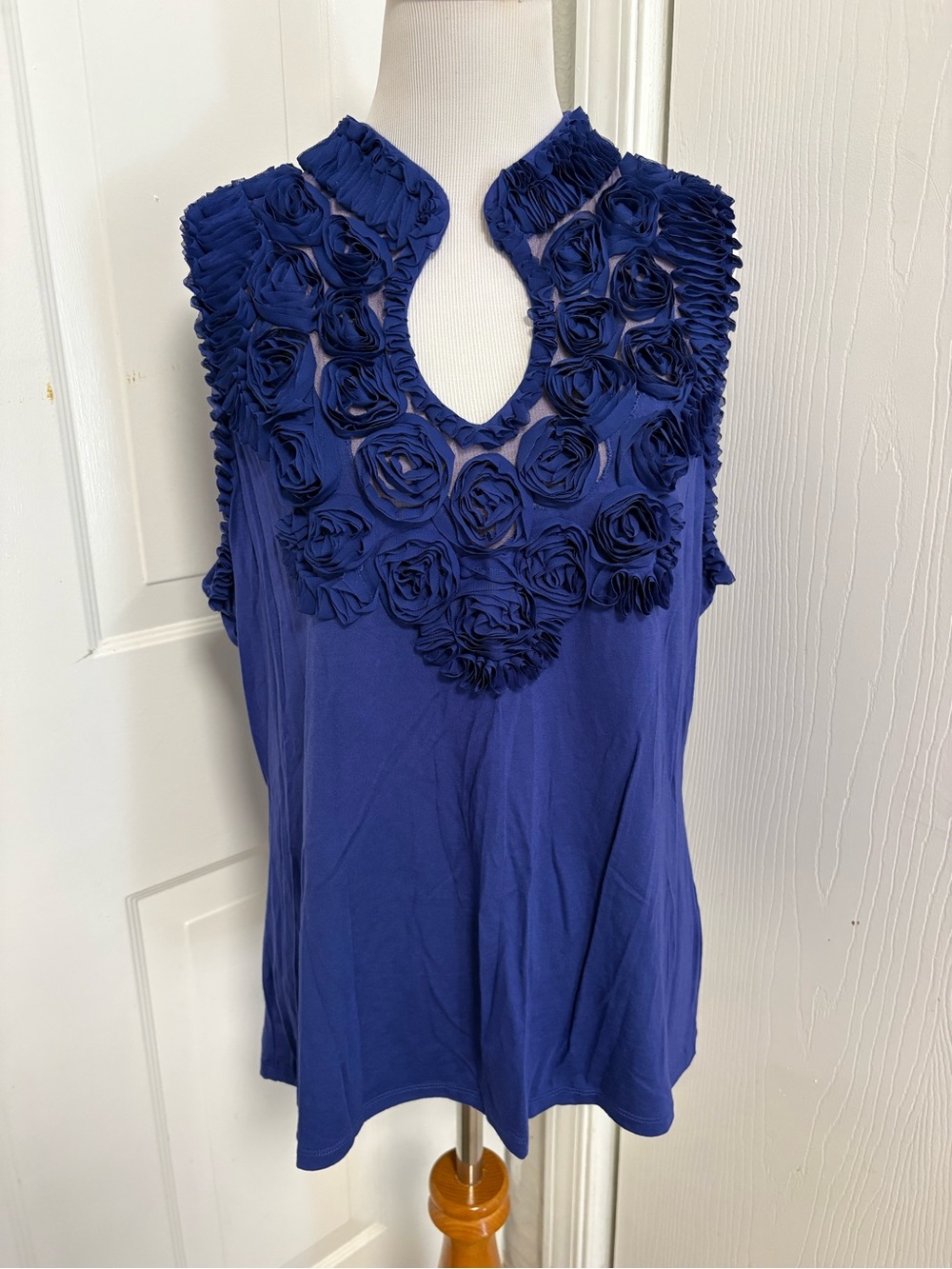Stera Rosette Sleeveless Blouse